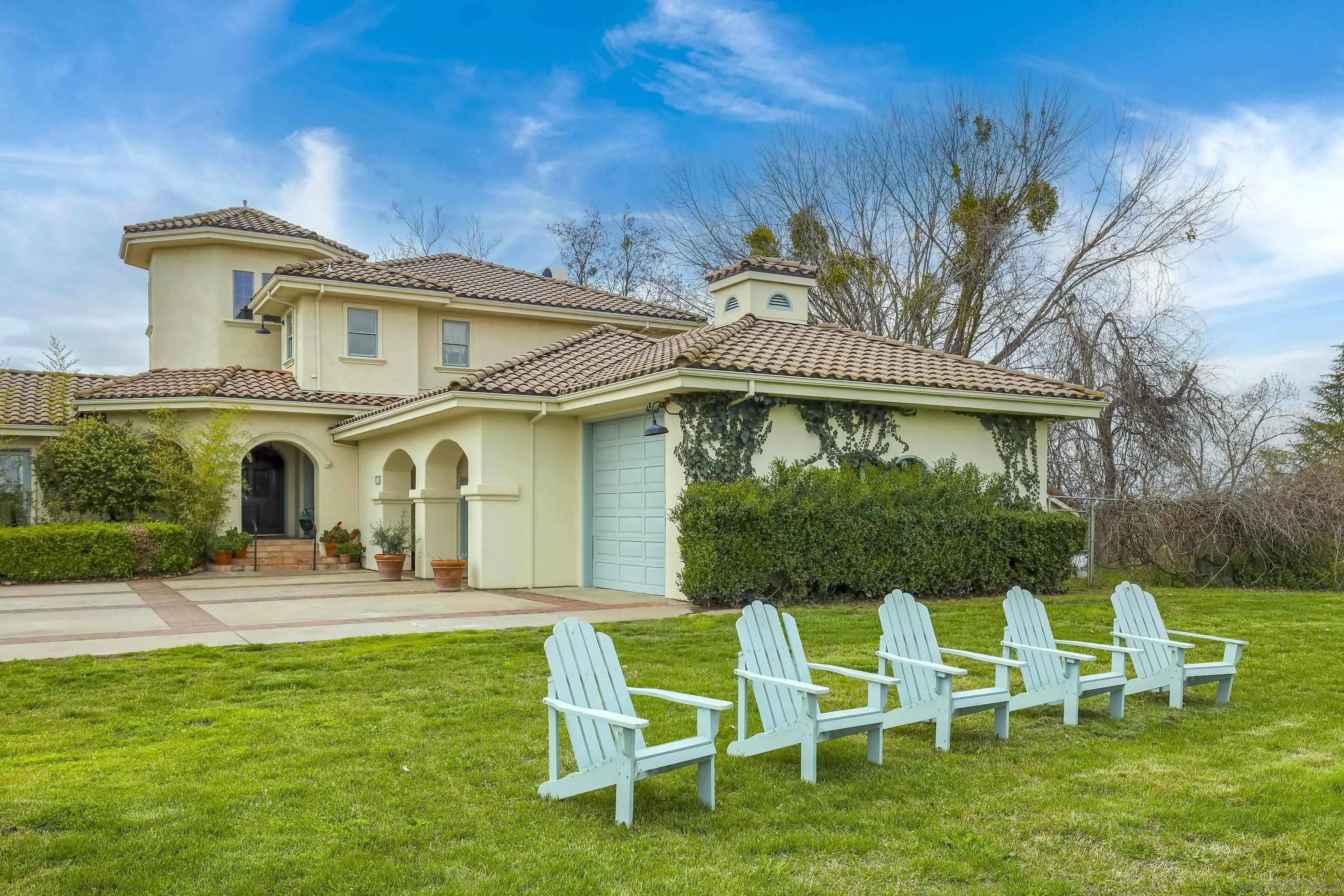 24943 North Mcintire Road Clements, CA 95227 - Photo 8 of 68 a front view of a house with a yard table and chairs