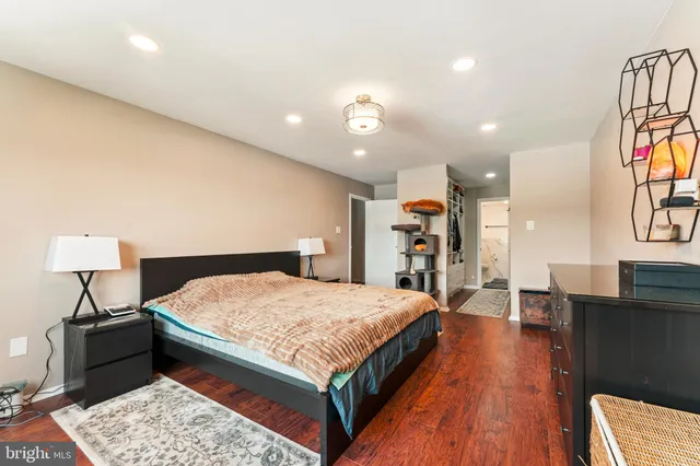 a bed room with a bed and a lamp