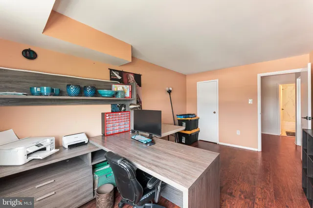 a workspace with furniture and window