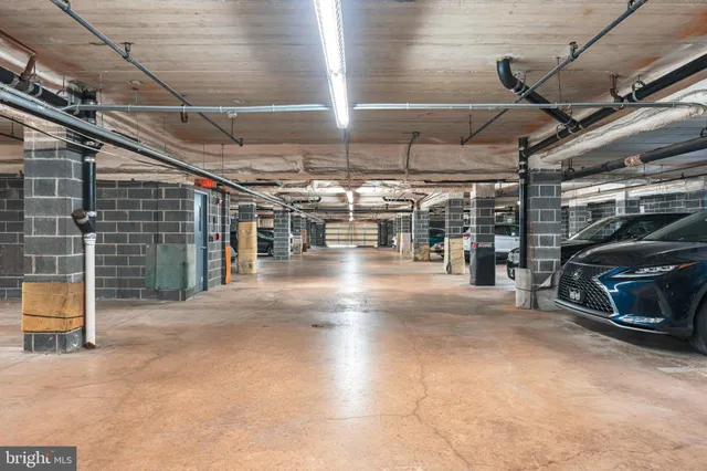 a view of parking garage with lots of traffic