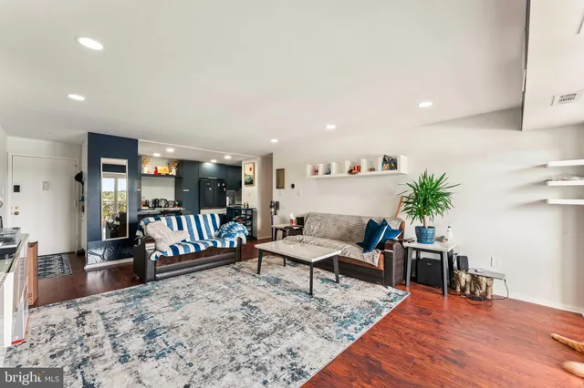 a living room with furniture and a rug