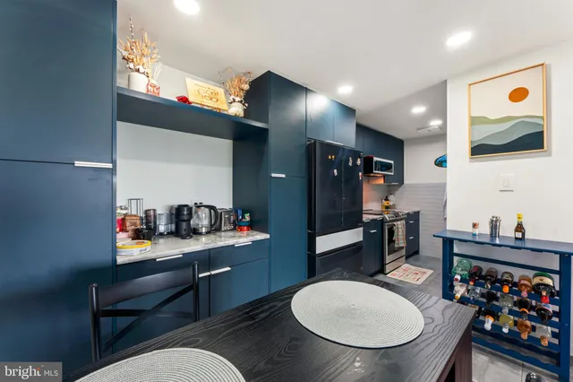a dining room with furniture and a mirror
