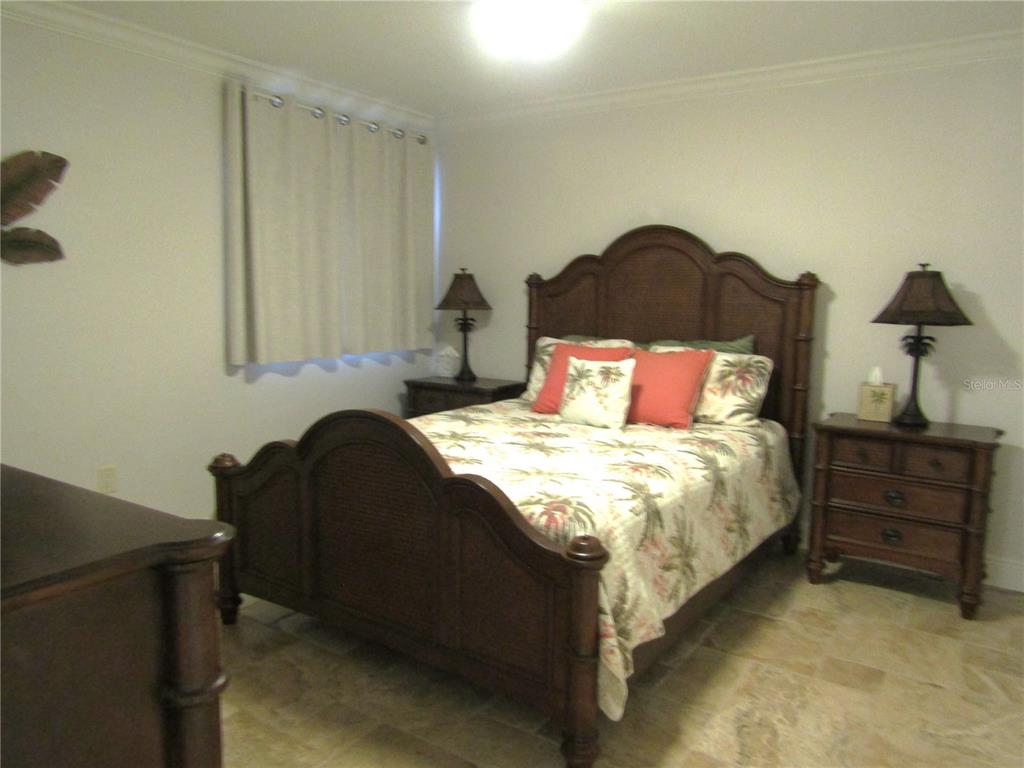 5056 Marsh Field Road, Unit 7 Sarasota, FL 34235 - Photo 20 of 31 a bedroom with a bed and a window