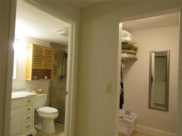 a bathroom with a toilet sink and shower