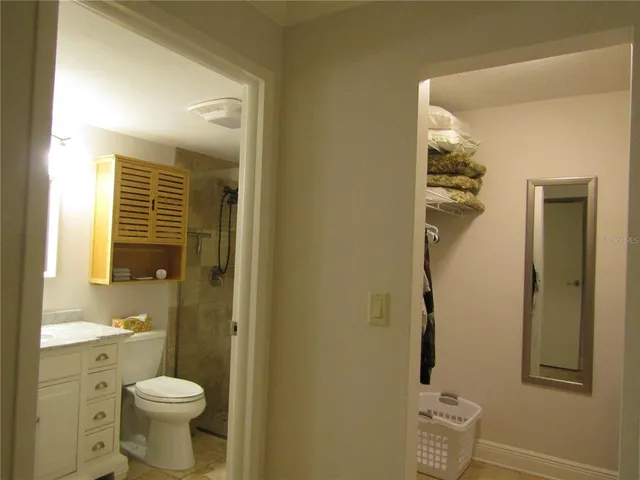a bathroom with a toilet sink and shower