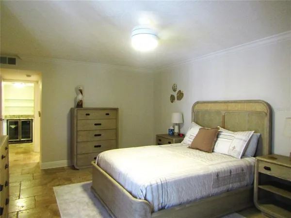 a bedroom with a bed and a cabinets