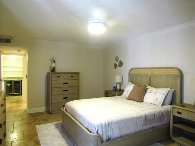 a bedroom with a bed and a cabinets