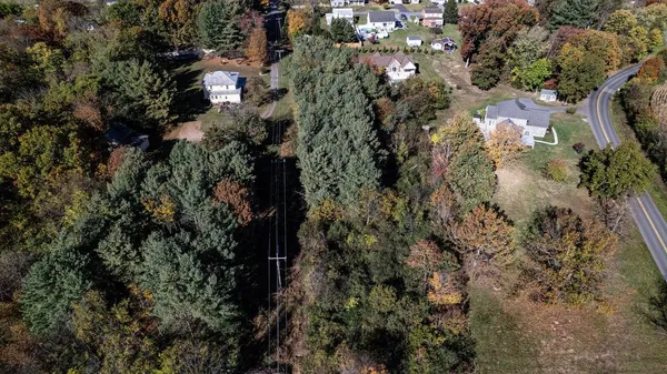 a view of a house with a tree