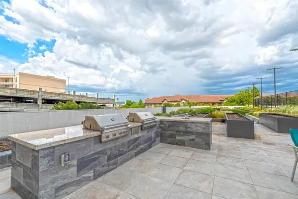 a view of a terrace with couches and potted plants