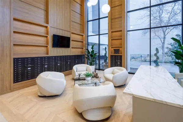 a kitchen with stainless steel appliances a refrigerator sink and white cabinets