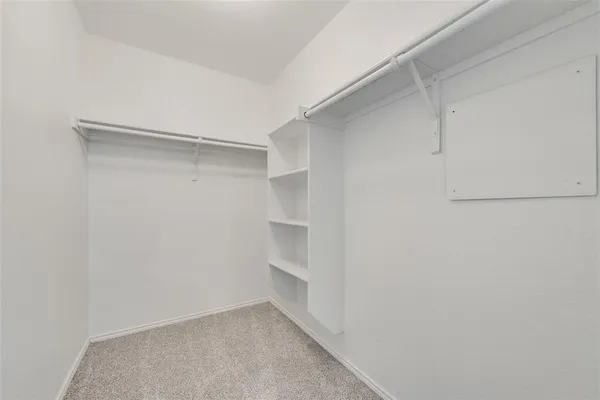 a view of an empty walk in closet