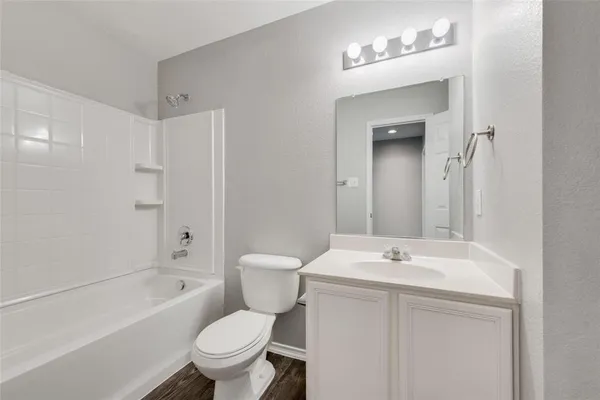a bathroom with a sink a toilet and a bathtub