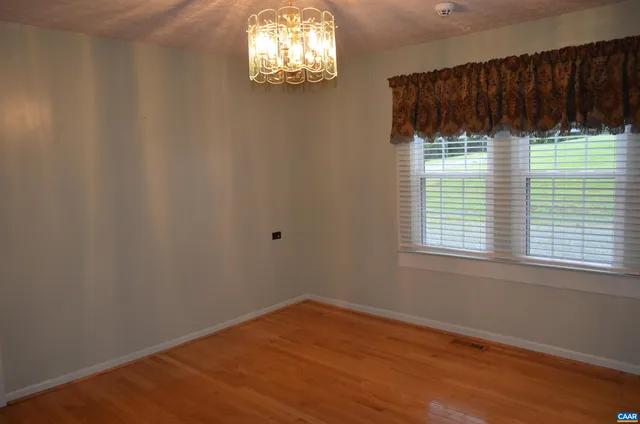 a bathroom with a granite countertop shower and a toilet