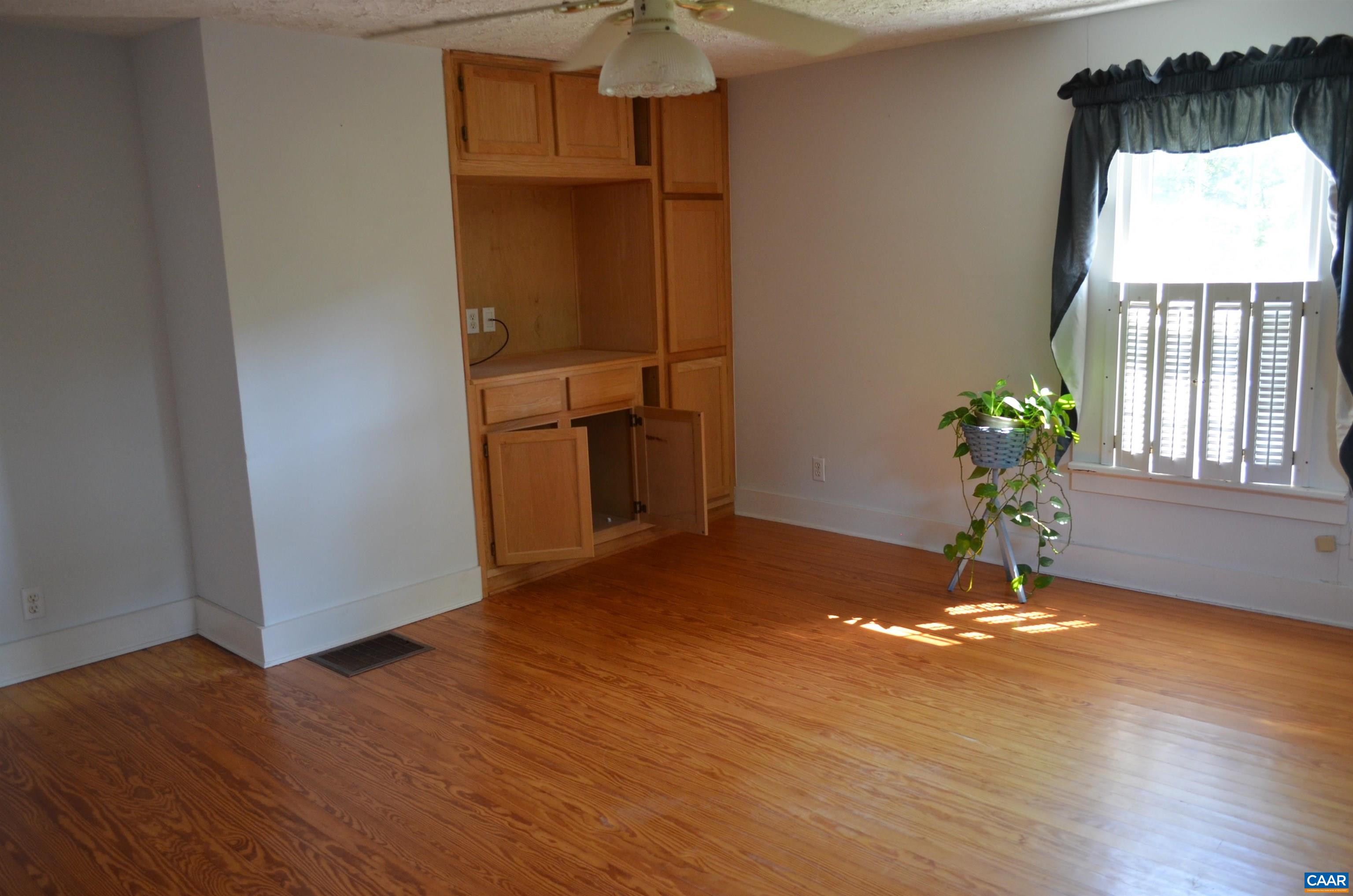 10778 Rockfish River Road Shipman, VA 22971 - Photo 33 of 67 a view of a livingroom with wooden floor and a window