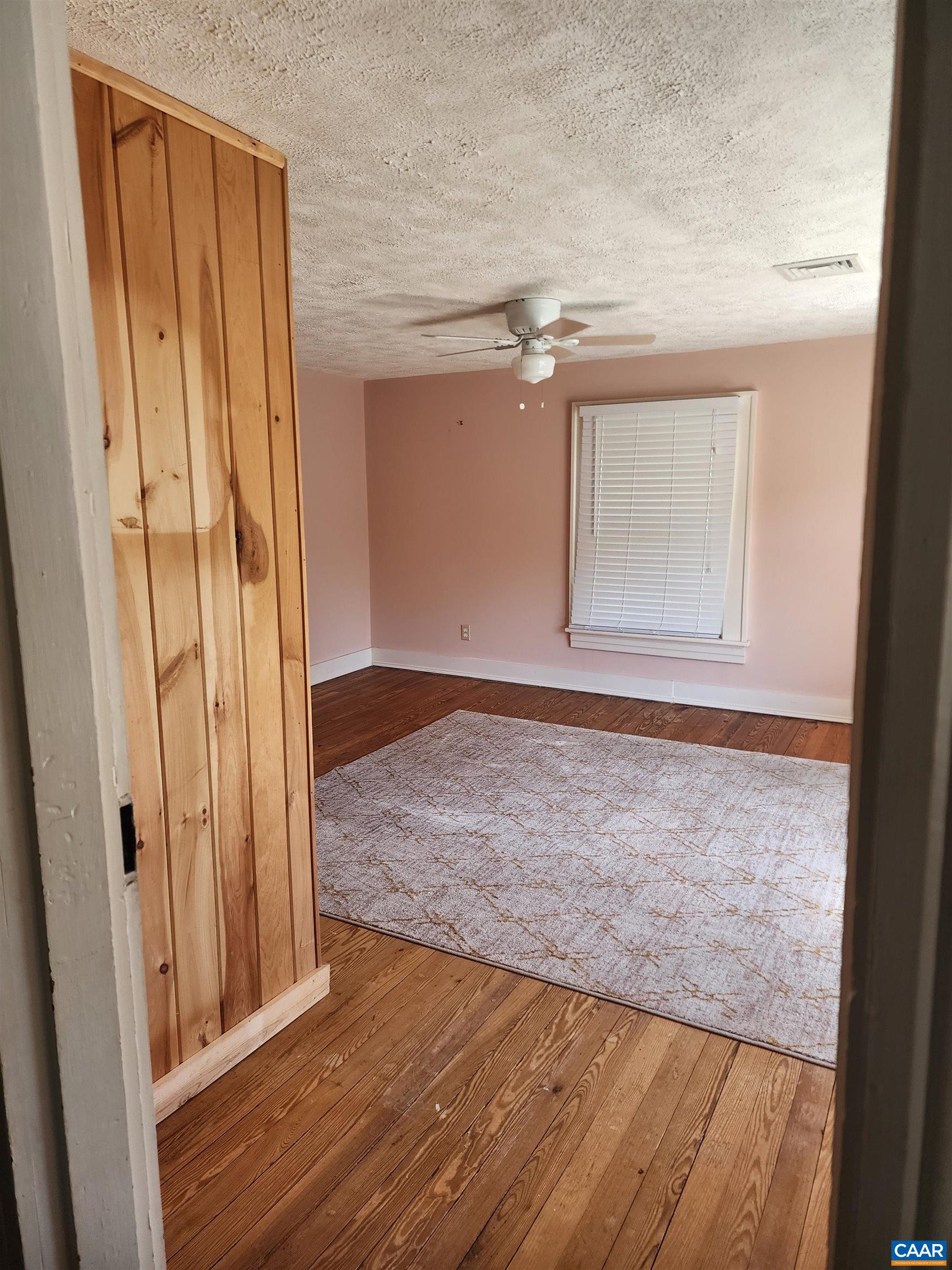 10778 Rockfish River Road Shipman, VA 22971 - Photo 43 of 67 an empty room with wooden floor and a window