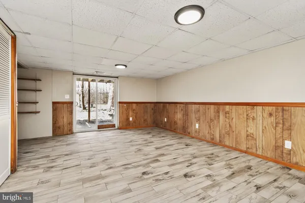 a view of an empty room and a window