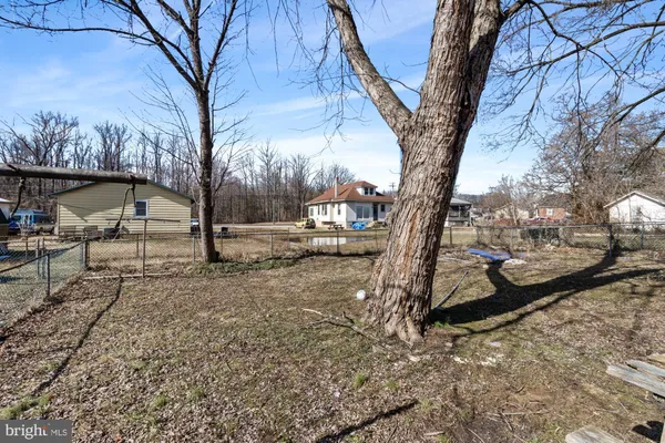 a view of balcony with wooden floor and fence