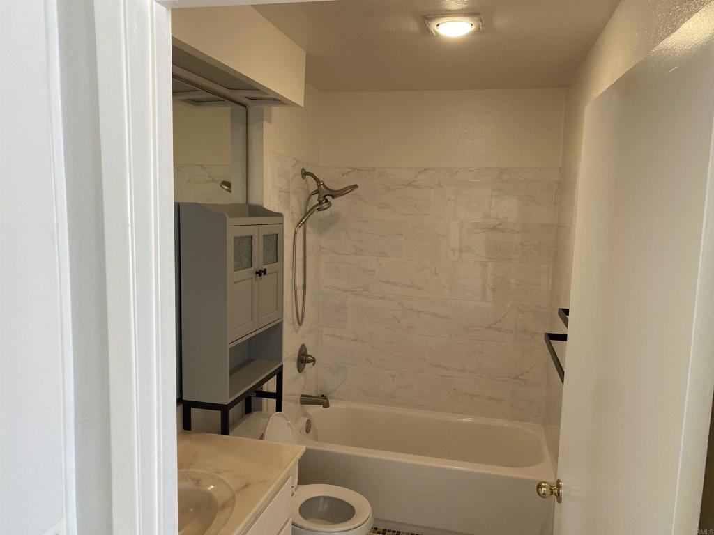 155 Rosebay Drive, Unit 42 Encinitas, CA 92024 - Photo 13 of 13 a bathroom with a bathtub and a shower