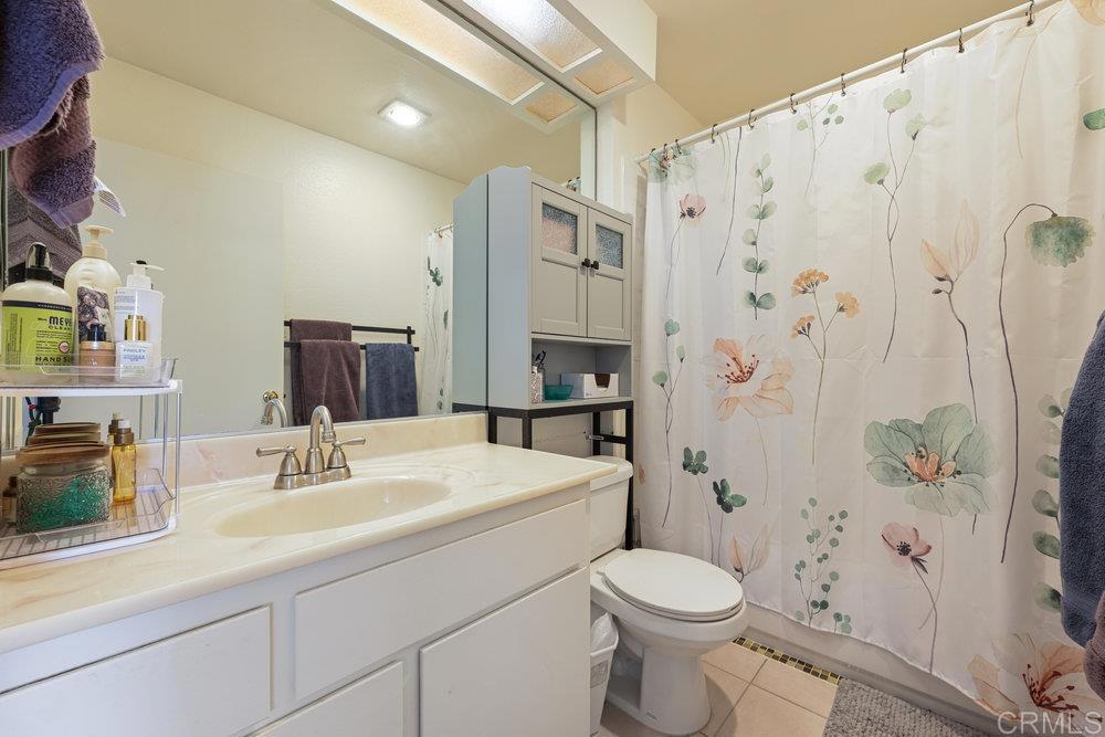 155 Rosebay Drive, Unit 42 Encinitas, CA 92024 - Photo 8 of 13 a bathroom with a sink toilet and shower