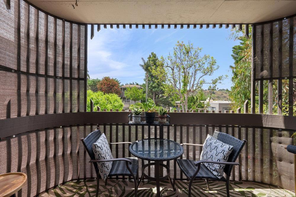 155 Rosebay Drive, Unit 42 Encinitas, CA 92024 - Photo 10 of 13 a view of a chairs and table in patio