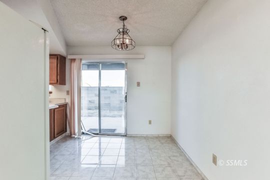 101 South Lilac Street Ridgecrest, CA 93555 - Photo 11 of 26 an empty room with windows