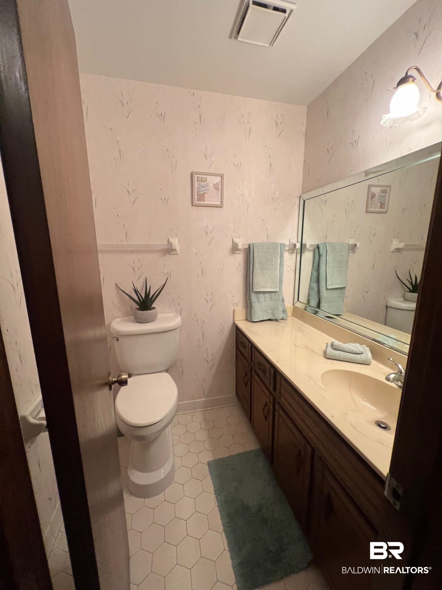 2240 Perdido Circle Lillian, AL 36549 - Photo 8 of 42 Bathroom with tile patterned flooring, vanity, and toilet