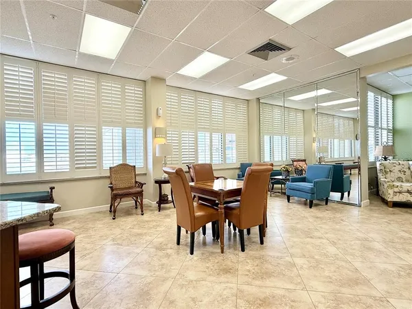 a view of a dining room with furniture and a table