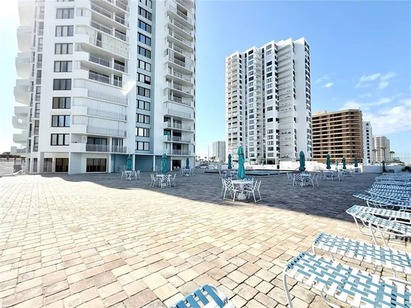 a view of a terrace with chairs