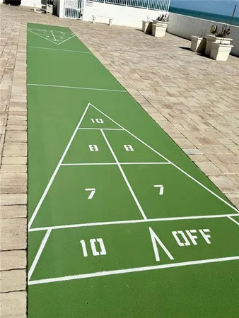 a view of a brick building next to a yard