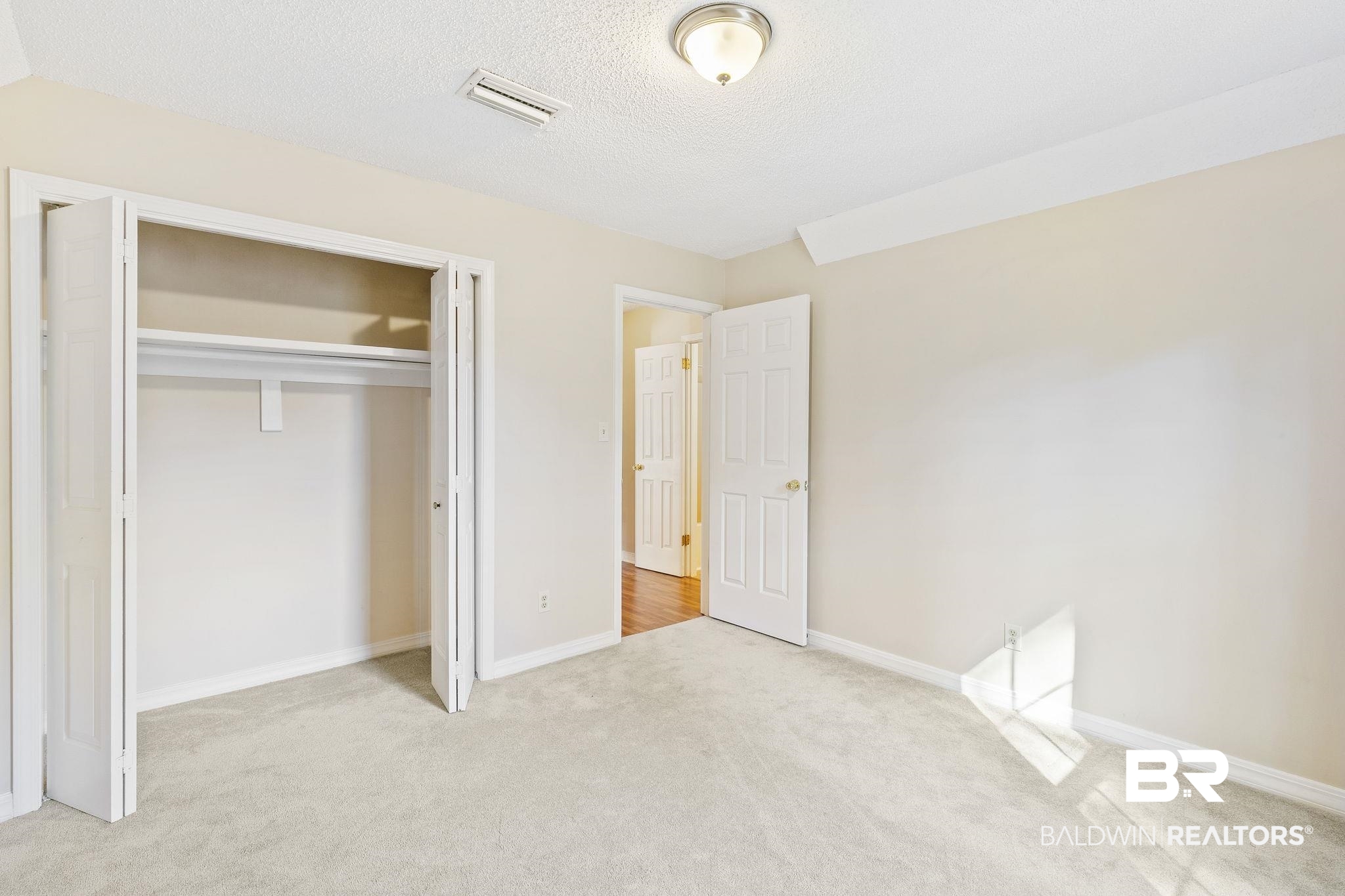 359 Ridgewood Drive Daphne, AL 36526 - Photo 43 of 73 Bedroom 3 has walk out attic access.