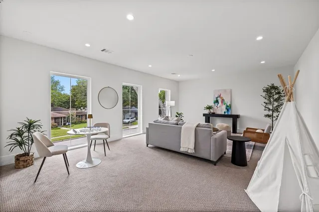 a living room with furniture and window