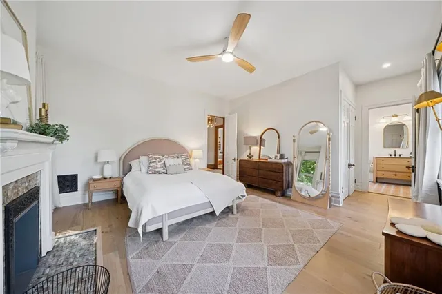 a living room with furniture a fireplace and a table