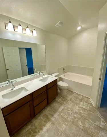 a bathroom with a glass door shower