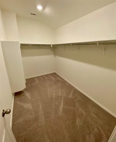 an empty room with a empty space and windows