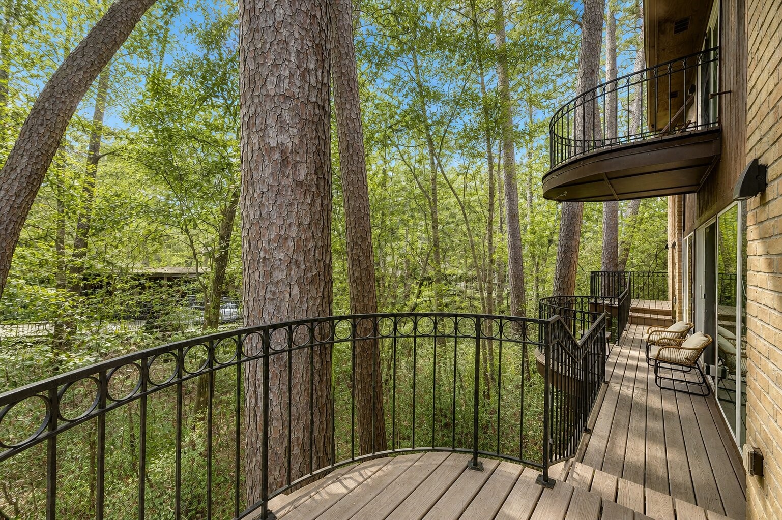 201 Vanderpool Lane, Unit 130 Houston, TX 77024 - Photo 10 of 41 View from the balcony looking Northwest. Pictured floating above is the primary suite private balcony.