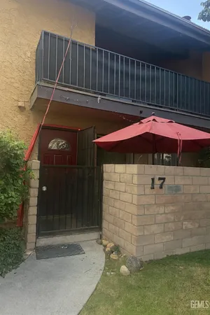 a patio with table and chairs