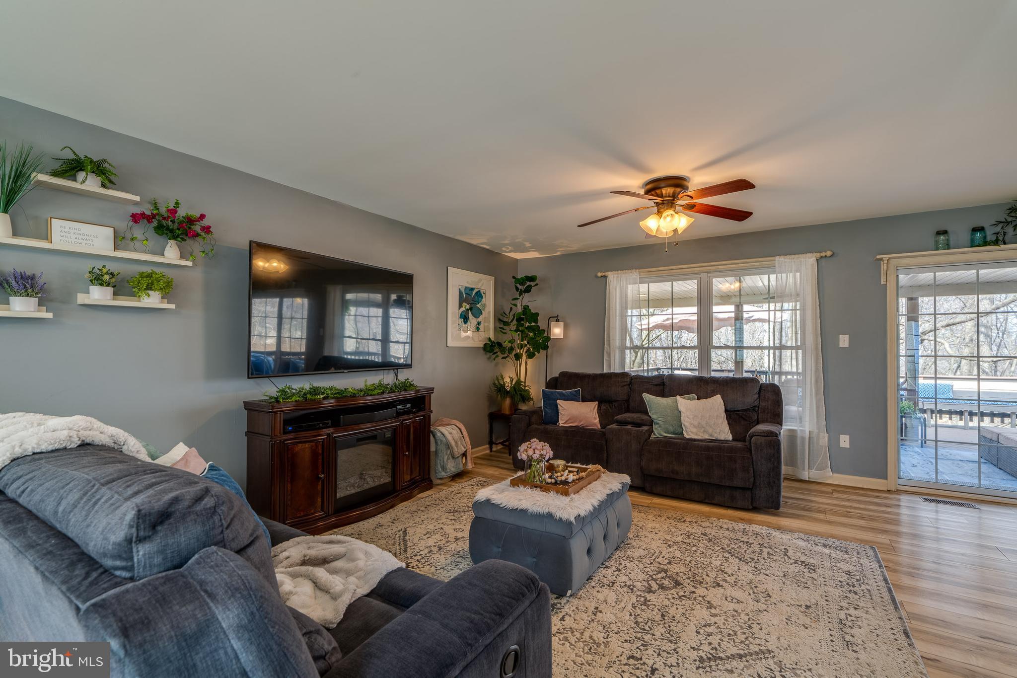 231 Owl Hill Road Lititz, PA 17543 - Photo 29 of 77 a living room with furniture a flat screen tv and a fireplace
