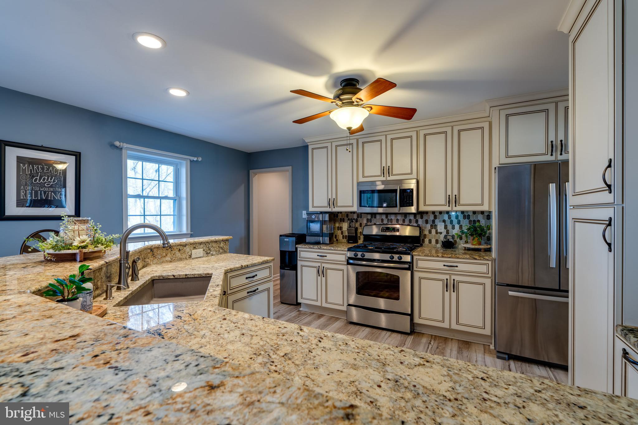 231 Owl Hill Road Lititz, PA 17543 - Photo 40 of 77 a kitchen with stainless steel appliances granite countertop a stove refrigerator and microwave