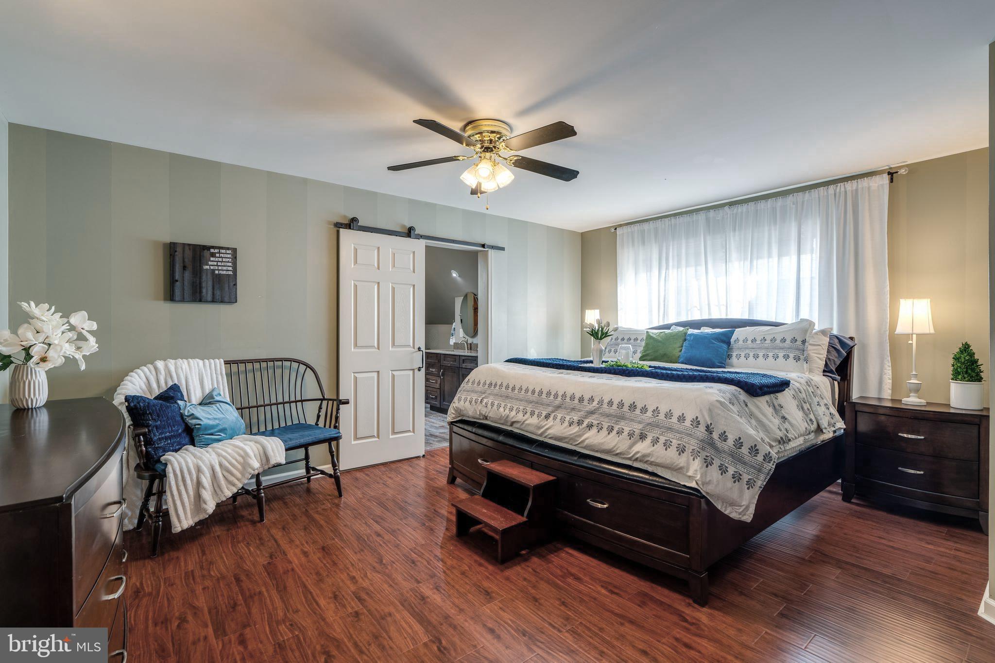 231 Owl Hill Road Lititz, PA 17543 - Photo 48 of 77 a bedroom with a bed and wooden floor