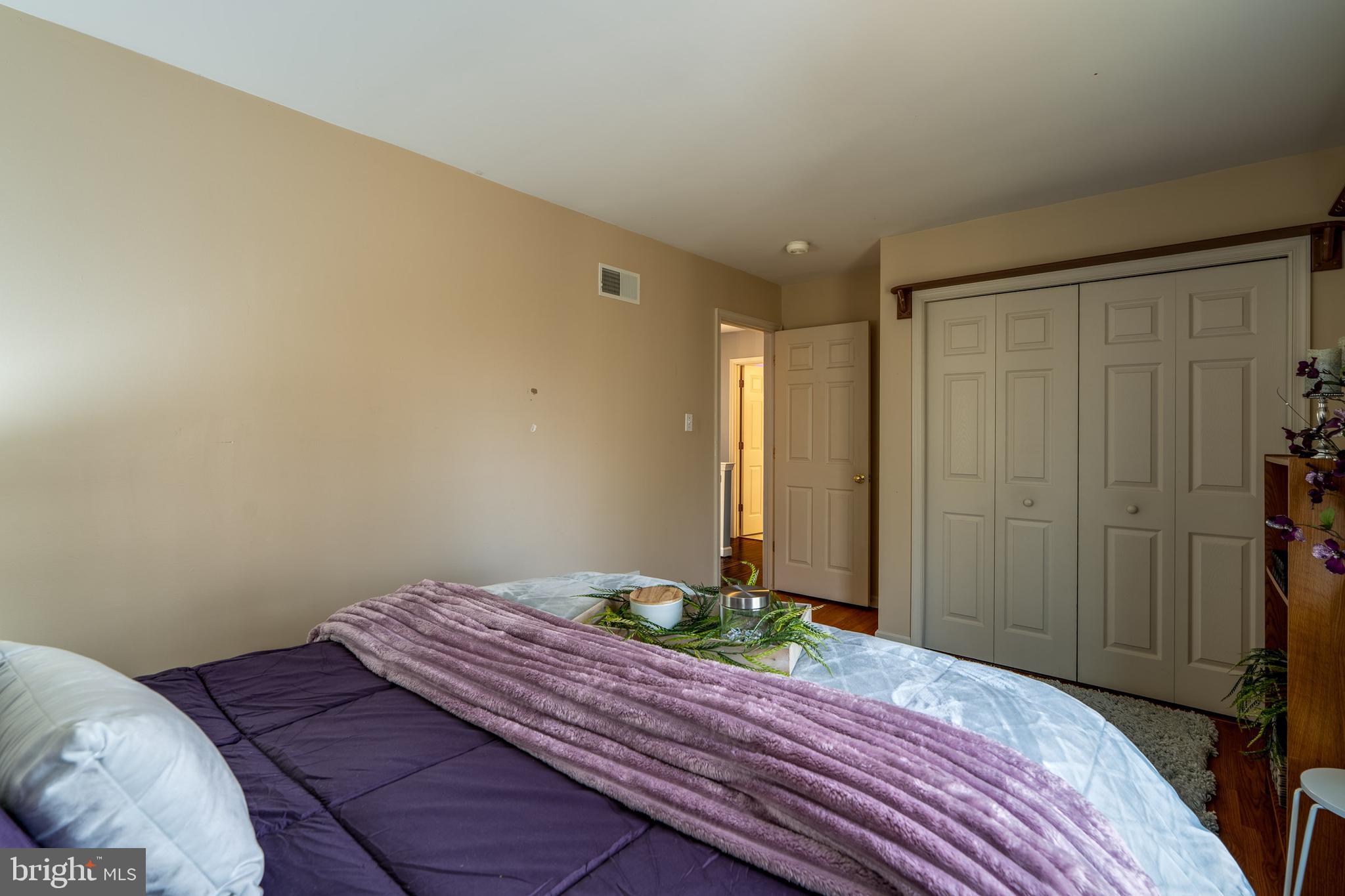 231 Owl Hill Road Lititz, PA 17543 - Photo 54 of 77 a bedroom with a bed and wooden floor