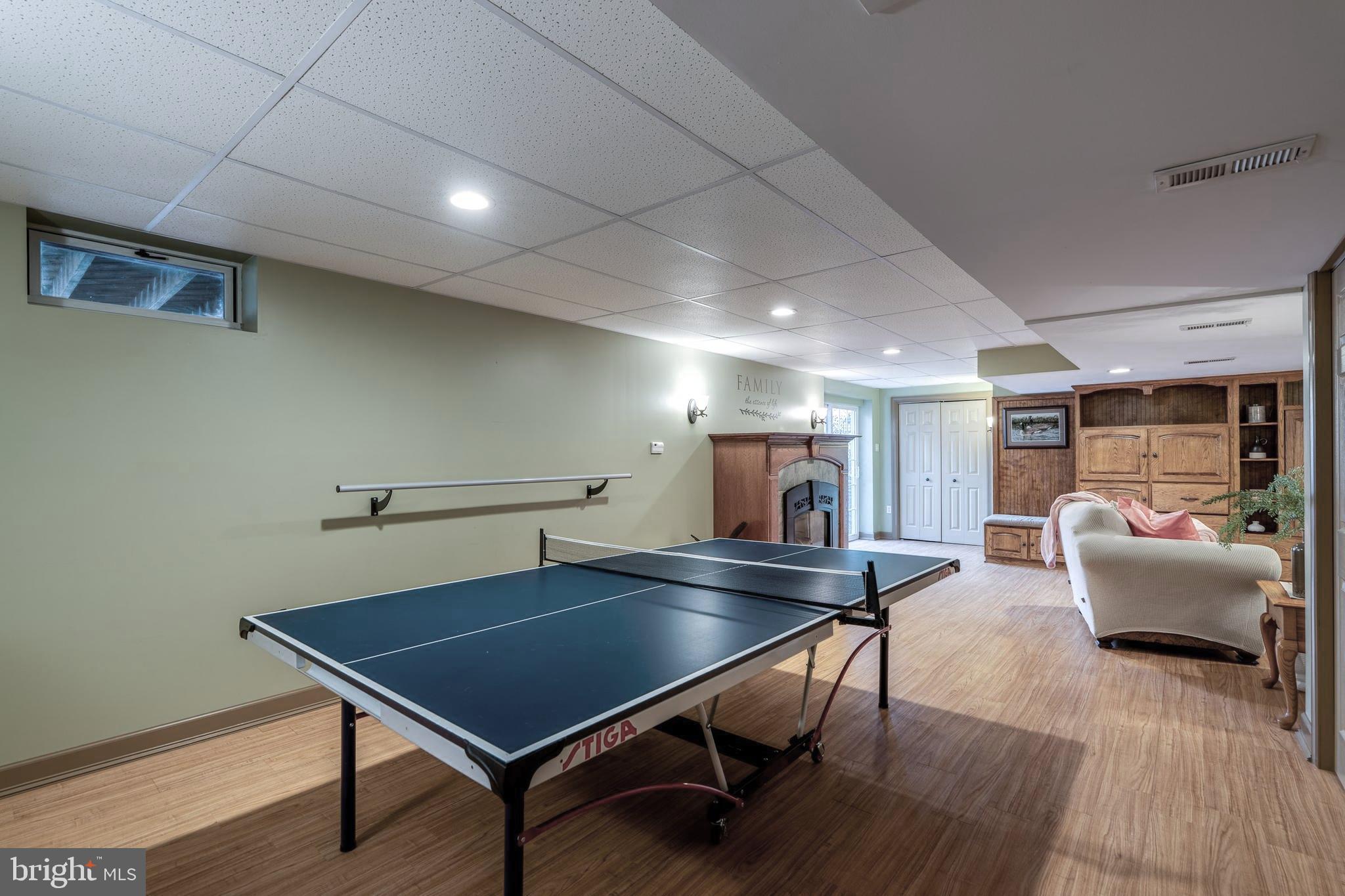 231 Owl Hill Road Lititz, PA 17543 - Photo 68 of 77 a living room with furniture a table and wooden floor
