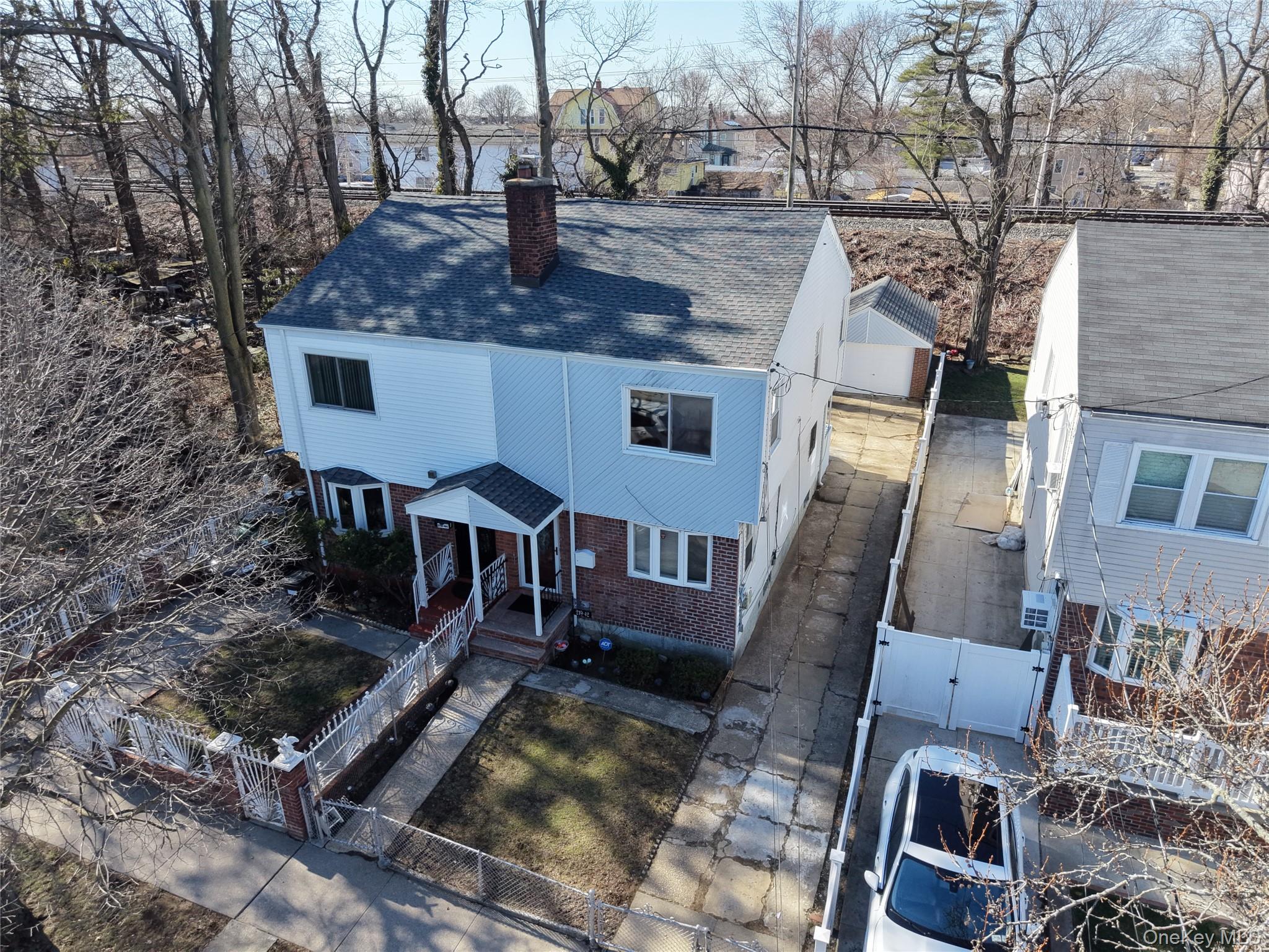 219-42 141st Road Queens, NY 11413 - Photo 11 of 23 a view of a house with backyard