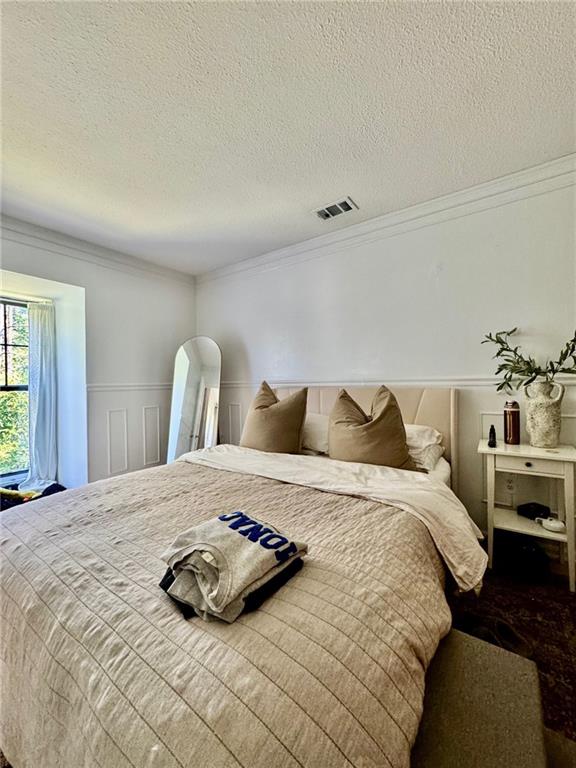 24311 Plantation Drive Northeast Atlanta, GA 30324 - Photo 11 of 31 a bedroom with a bed and a couch