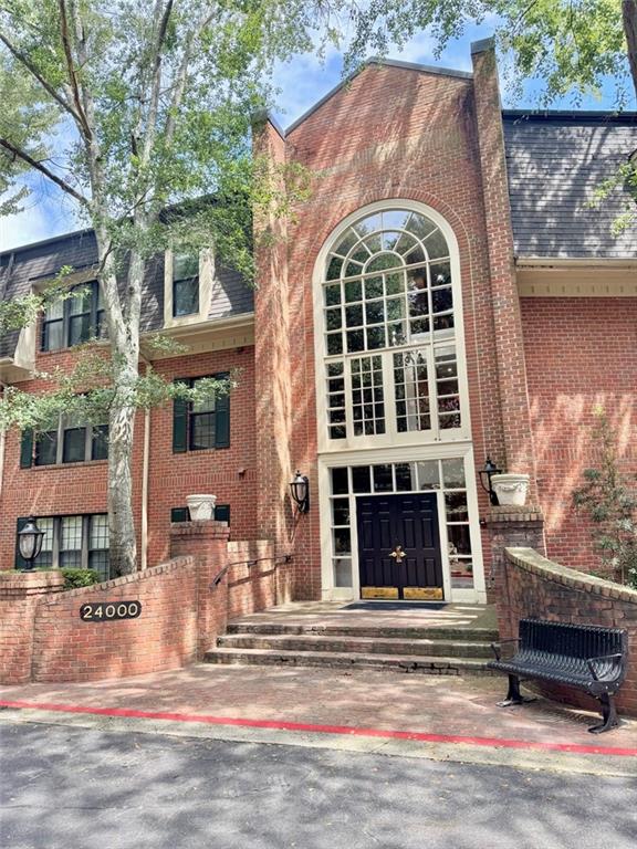 24311 Plantation Drive Northeast Atlanta, GA 30324 - Photo 2 of 31 a front view of a house with a yard