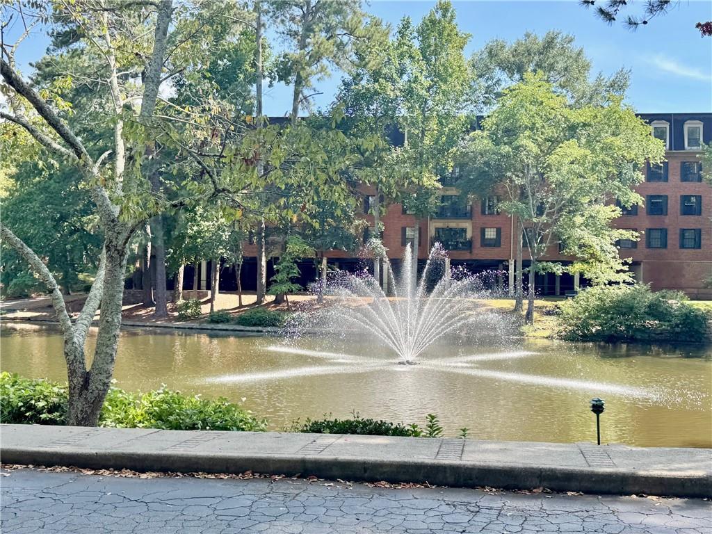 24311 Plantation Drive Northeast Atlanta, GA 30324 - Photo 28 of 31 a view of swimming pool with outdoor seating and lake view