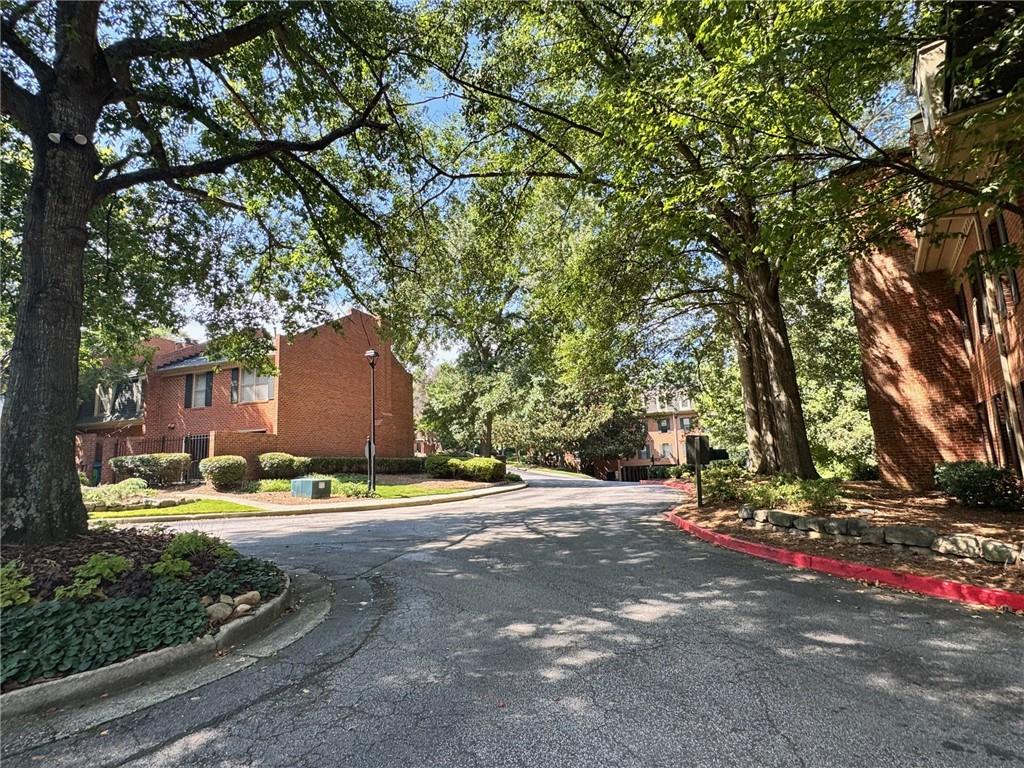24311 Plantation Drive Northeast Atlanta, GA 30324 - Photo 29 of 31 a backyard of a house with lots of green space and fountain