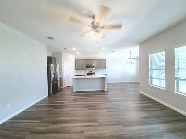 a view of kitchen with wooden floor and window
