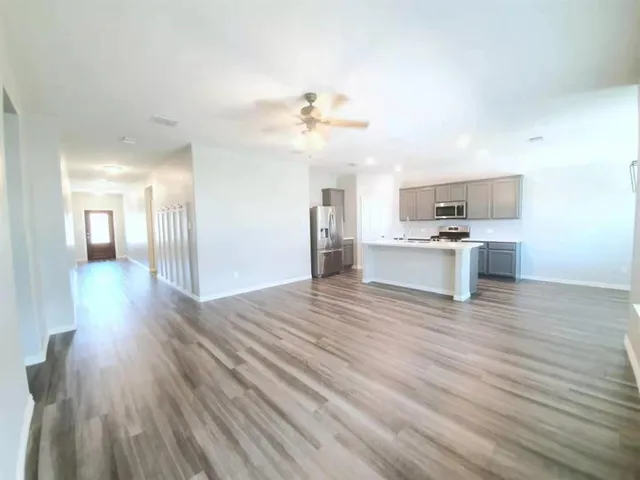 a view of a kitchen with a sink and a microwave