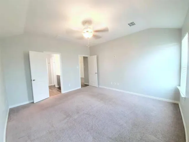 an empty room with a bathroom