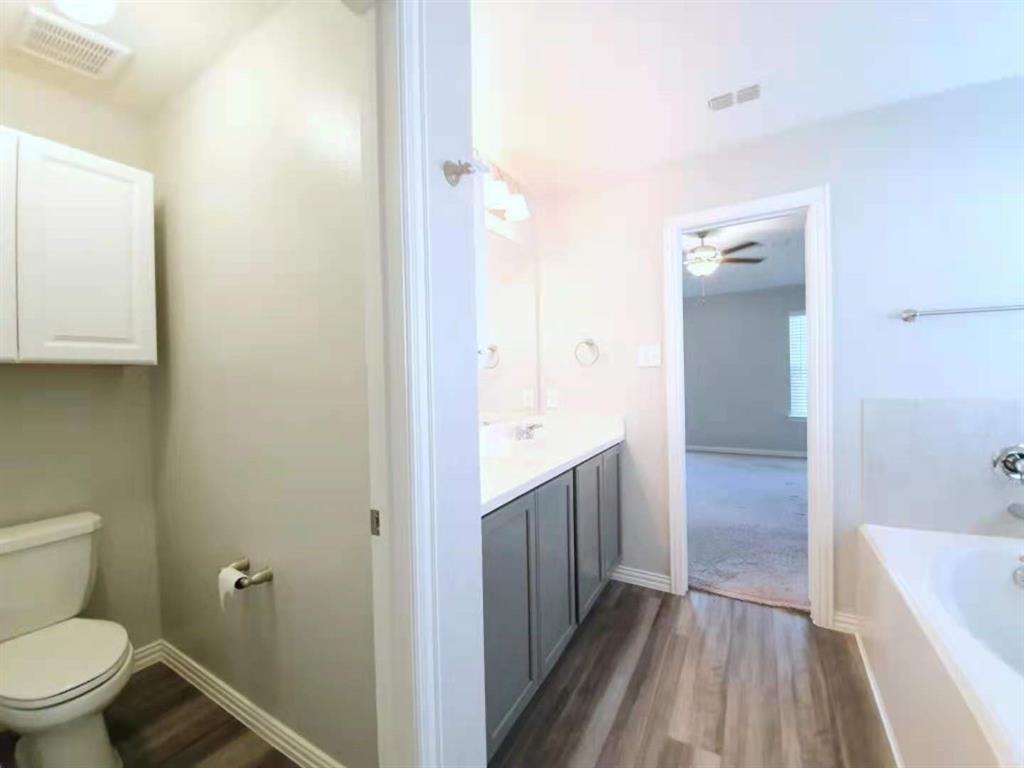 822 Spruce Lane Princeton, TX 75407 - Photo 26 of 35 a bathroom with a sink a toilet and shower